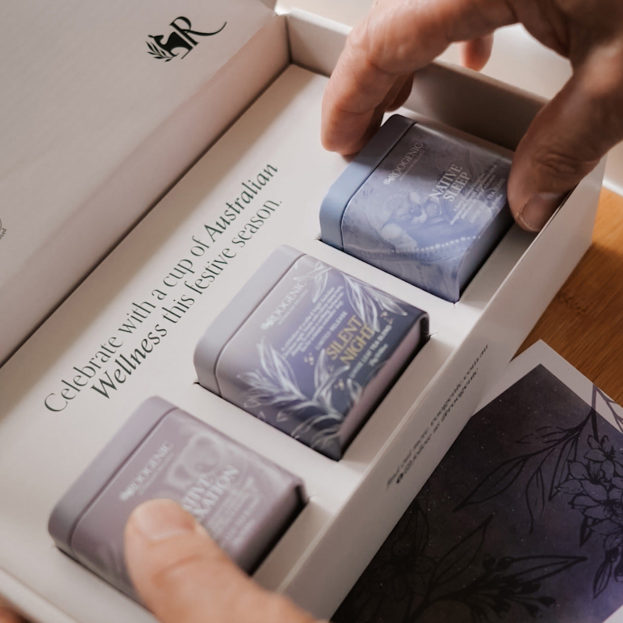 hands touching Sleep Well Gift Box