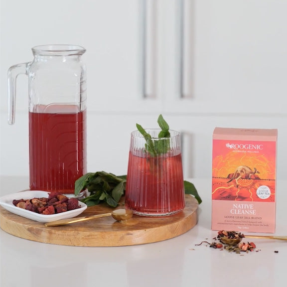 Native Strawberry Tea with Brewed Jug surrounded by box and ingredients